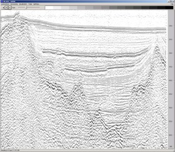 A deep penetration boomer
                sub-bottom profile displaying bedrock/hard till surface
                under postglacial and glacial sediments